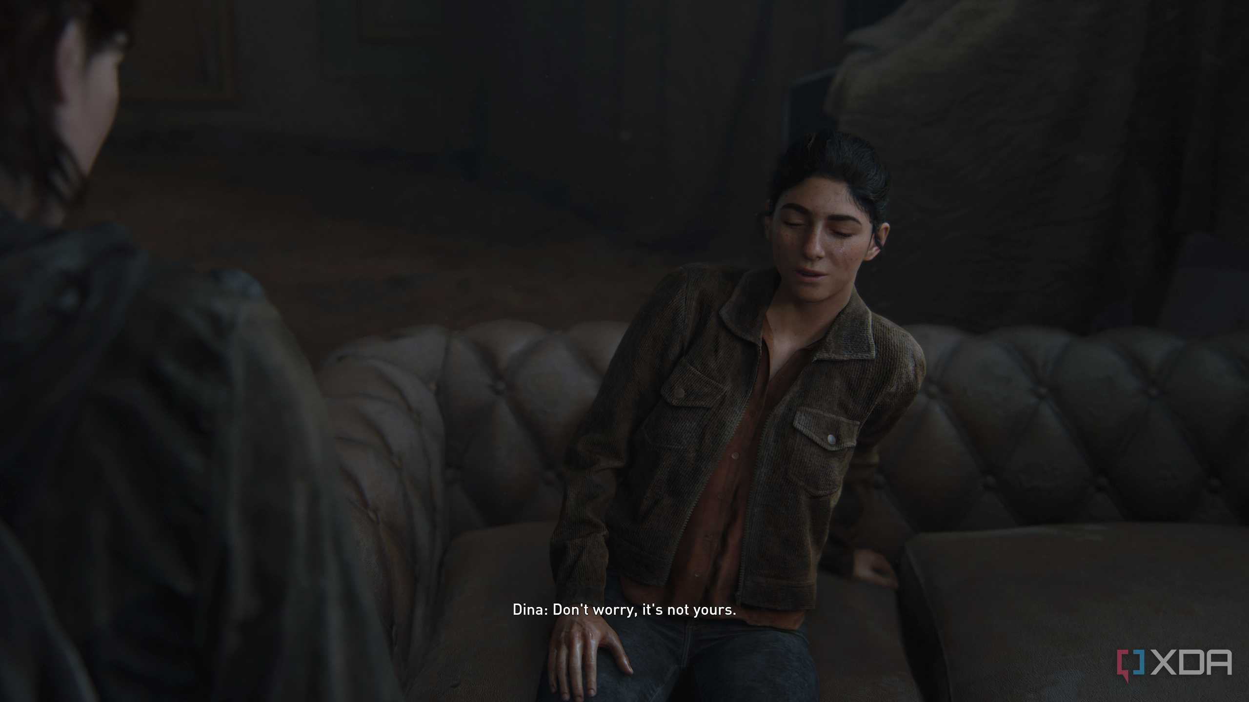 An image from the game The Last of Us Part II Remastered on PC, showing Dina crying and making a joke.