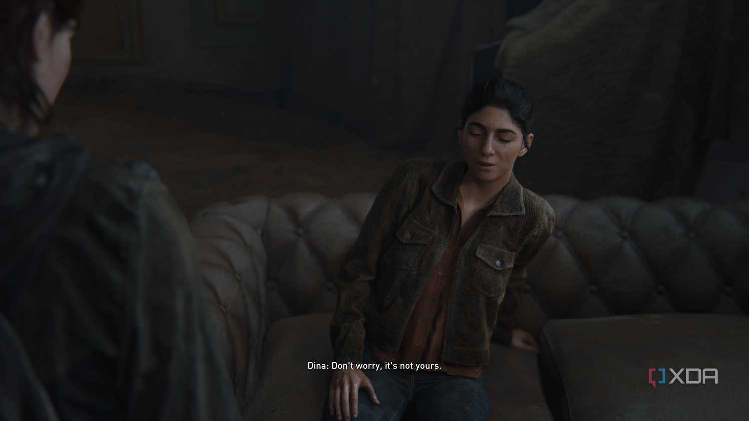 An image from the game The Last of Us Part II Remastered on PC, showing Dina crying and making a joke.