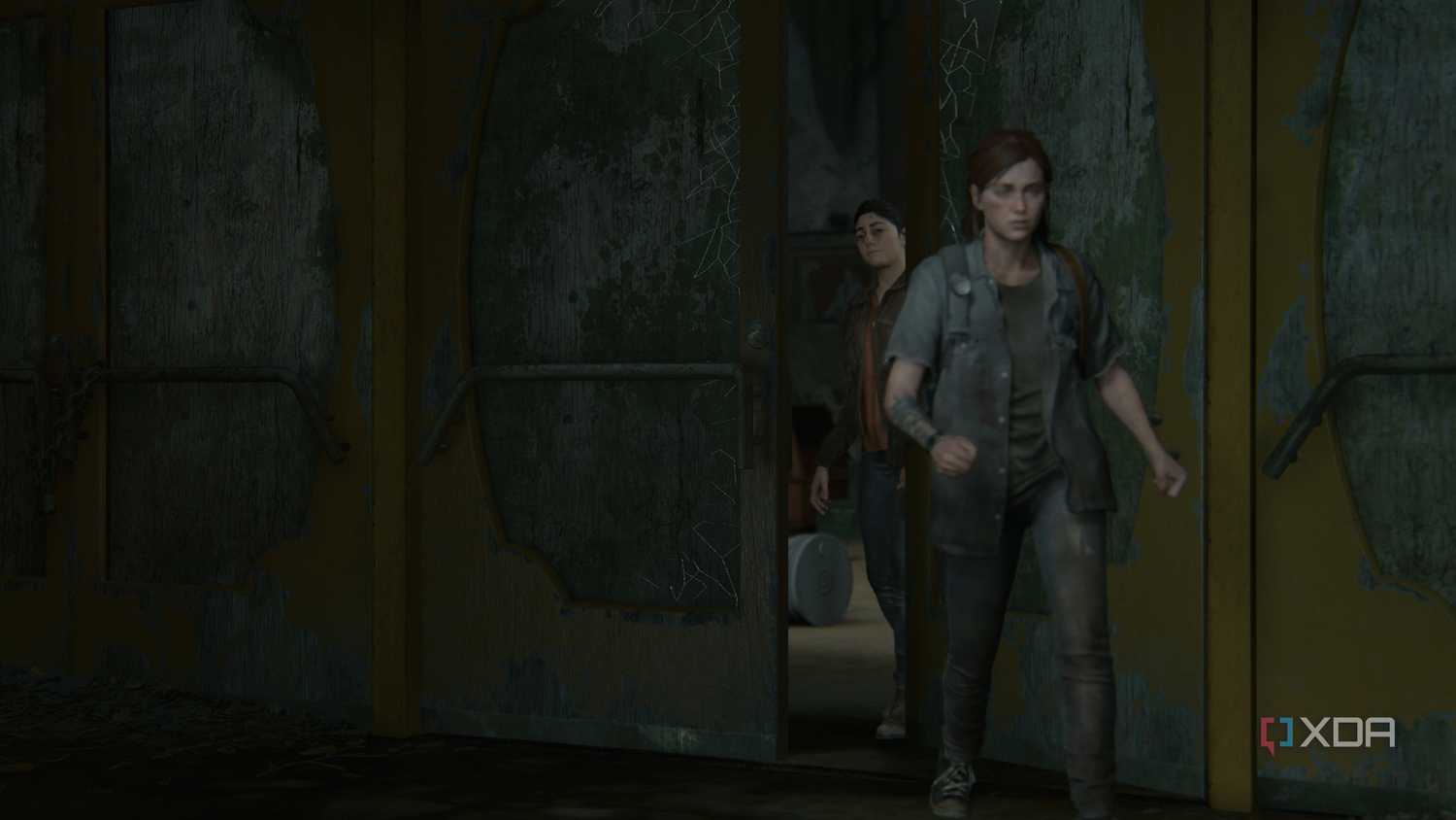 Ellie leaving the hideout while Dina closes the door behind her.