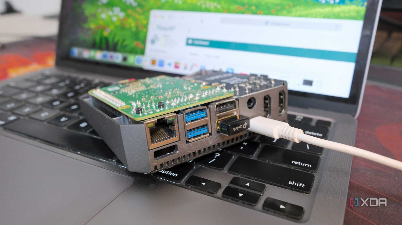 A Raspberry with a USB Wi-Fi adapter attached to turn it into a travel router