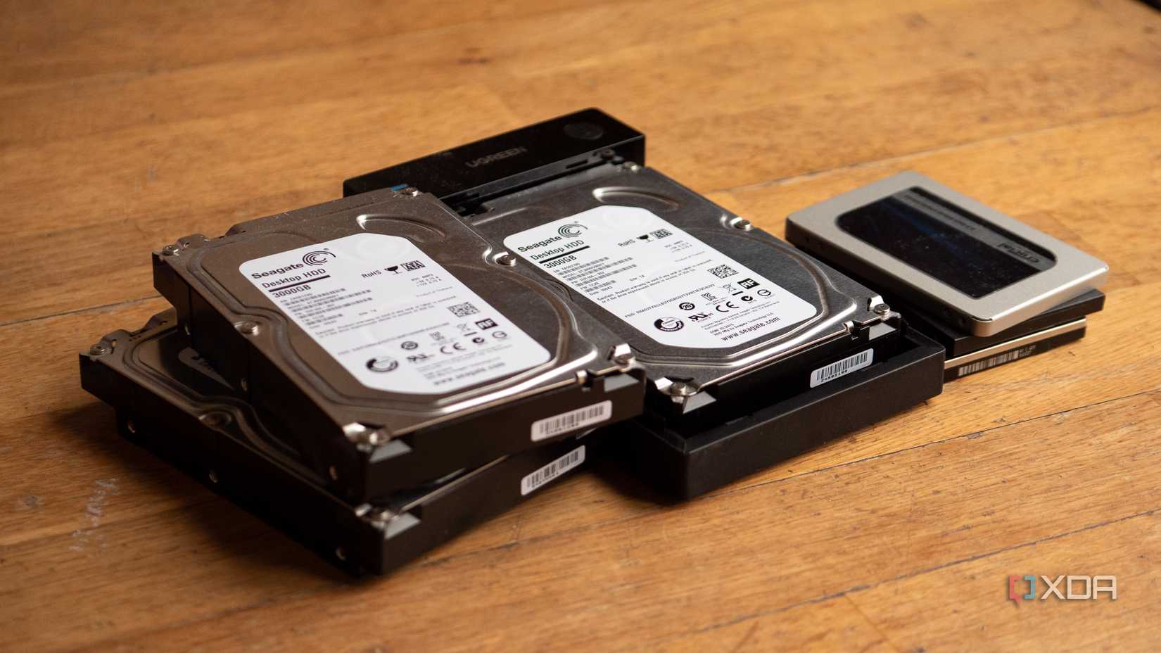 A few HDDs and SSDs, with one HDD inside of a Ugreen HDD enclosure
