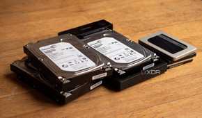 A few HDDs and SSDs, with one HDD inside of a Ugreen HDD enclosure