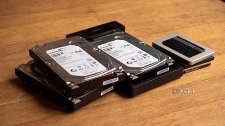A few HDDs and SSDs, with one HDD inside of a Ugreen HDD enclosure