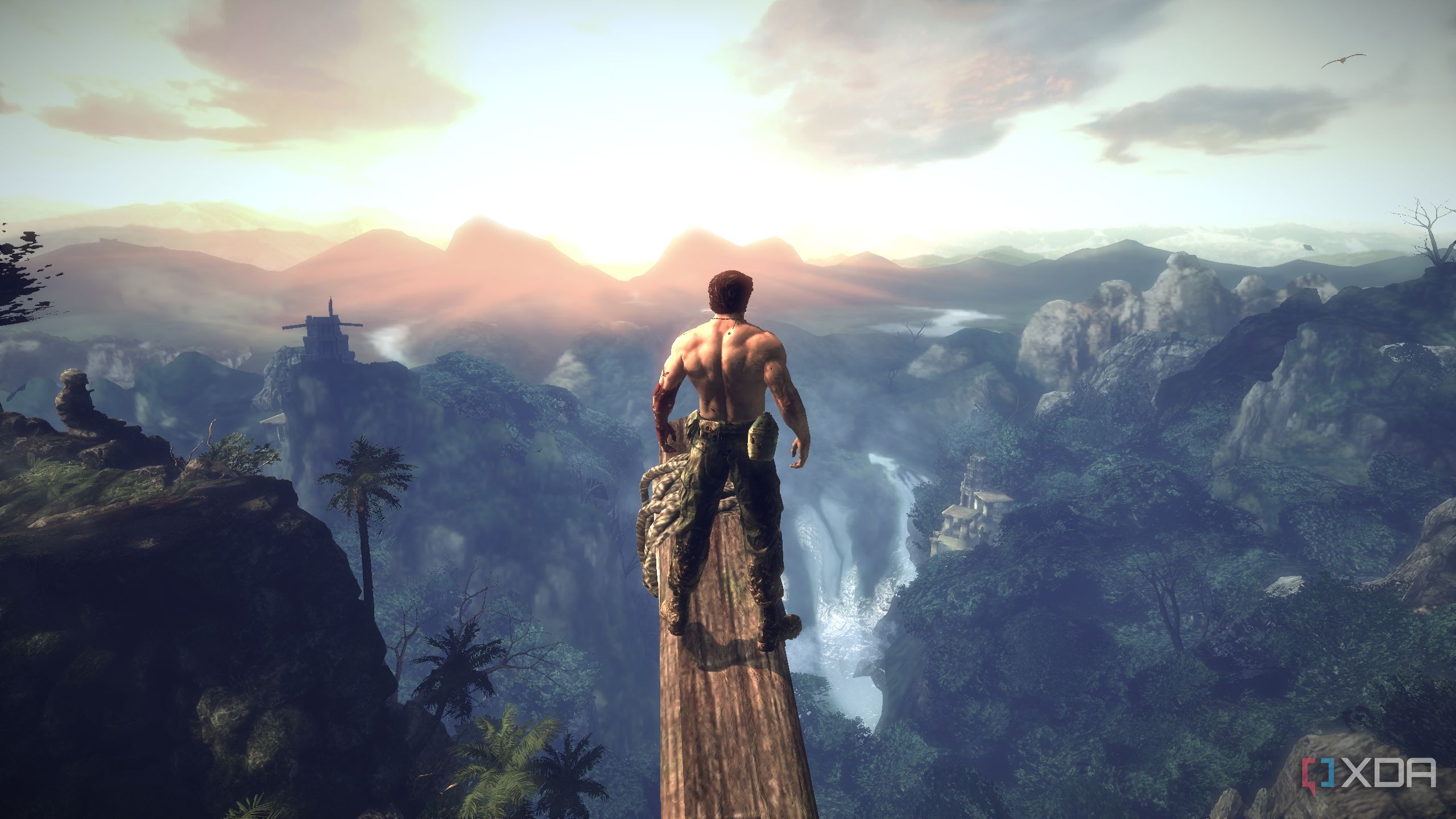 Logan standing on a wooden beam, taking in a setting sun in X-Men Origins: Wolverine.