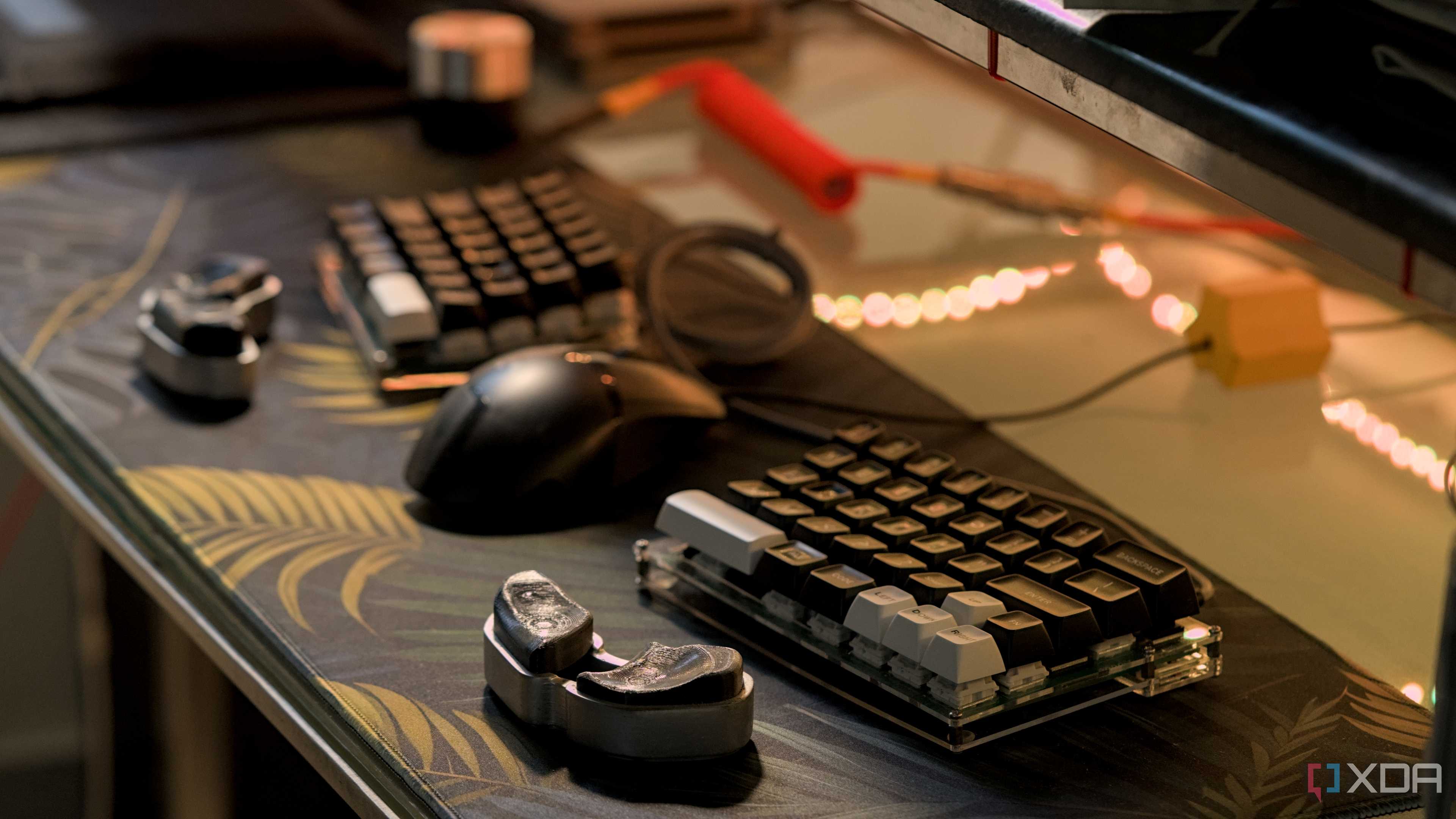 Custom 3D printed wrist rests on a desk with a split 60% keyboard