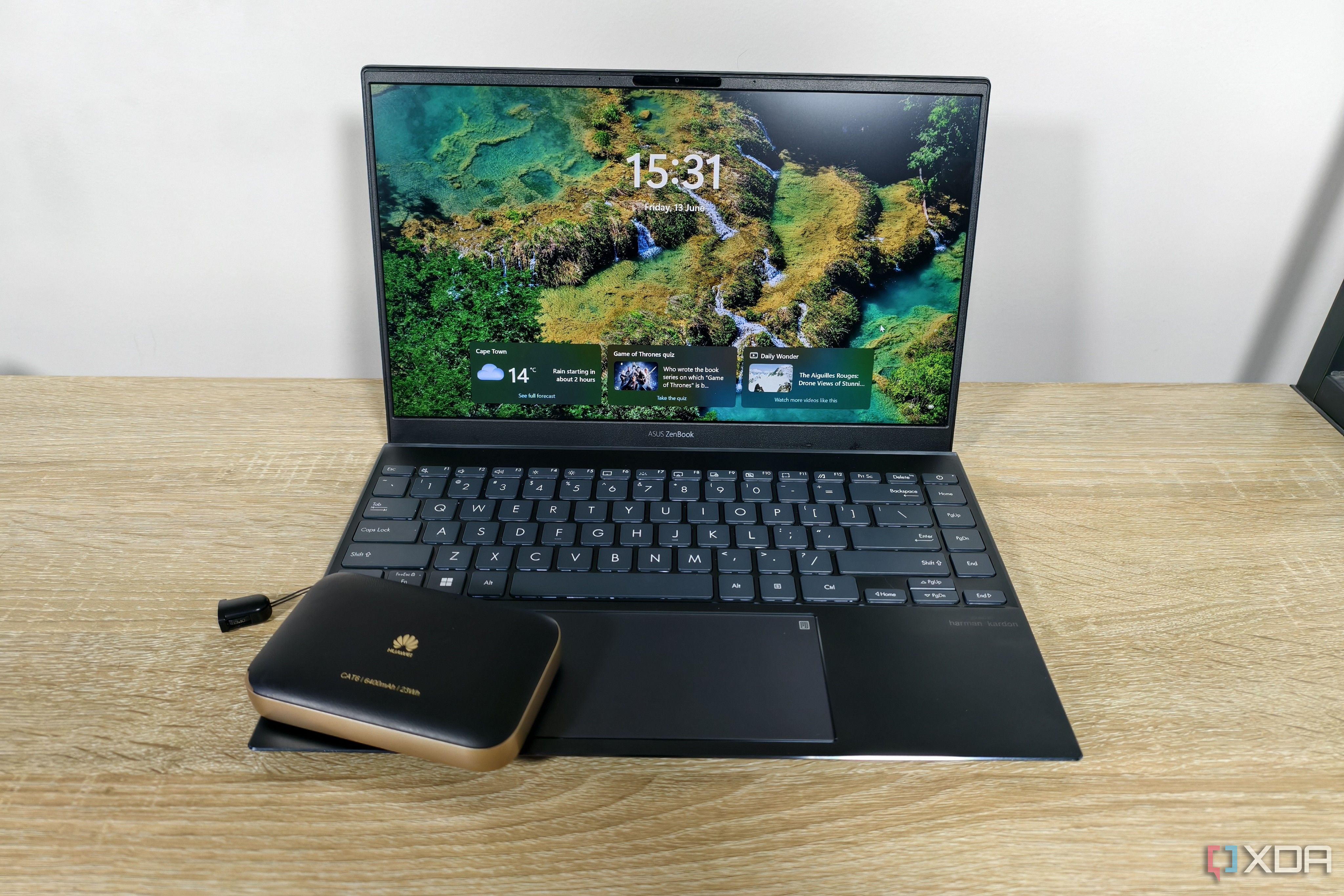 a mobile router with a laptop on a table