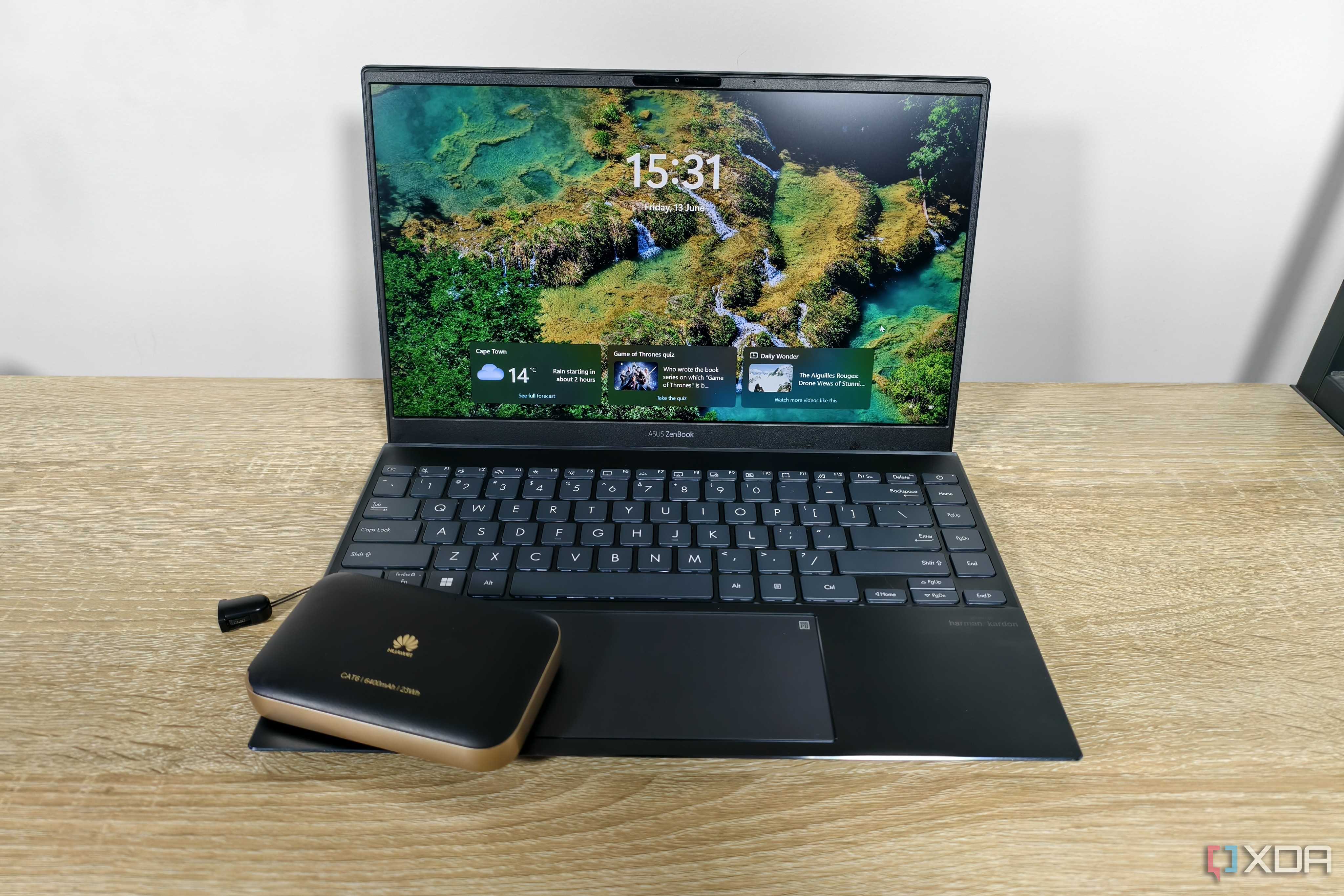 a mobile router with a laptop on a table