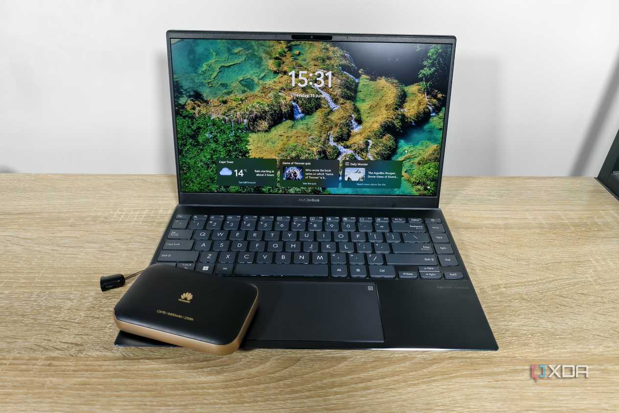a mobile router with a laptop on a table