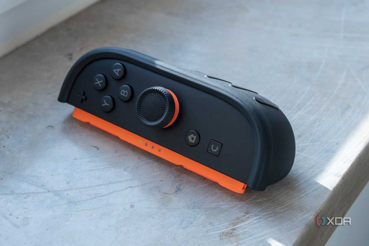 Close-up of the right Joy-Con 2 with the Dbrand thumb grip installed