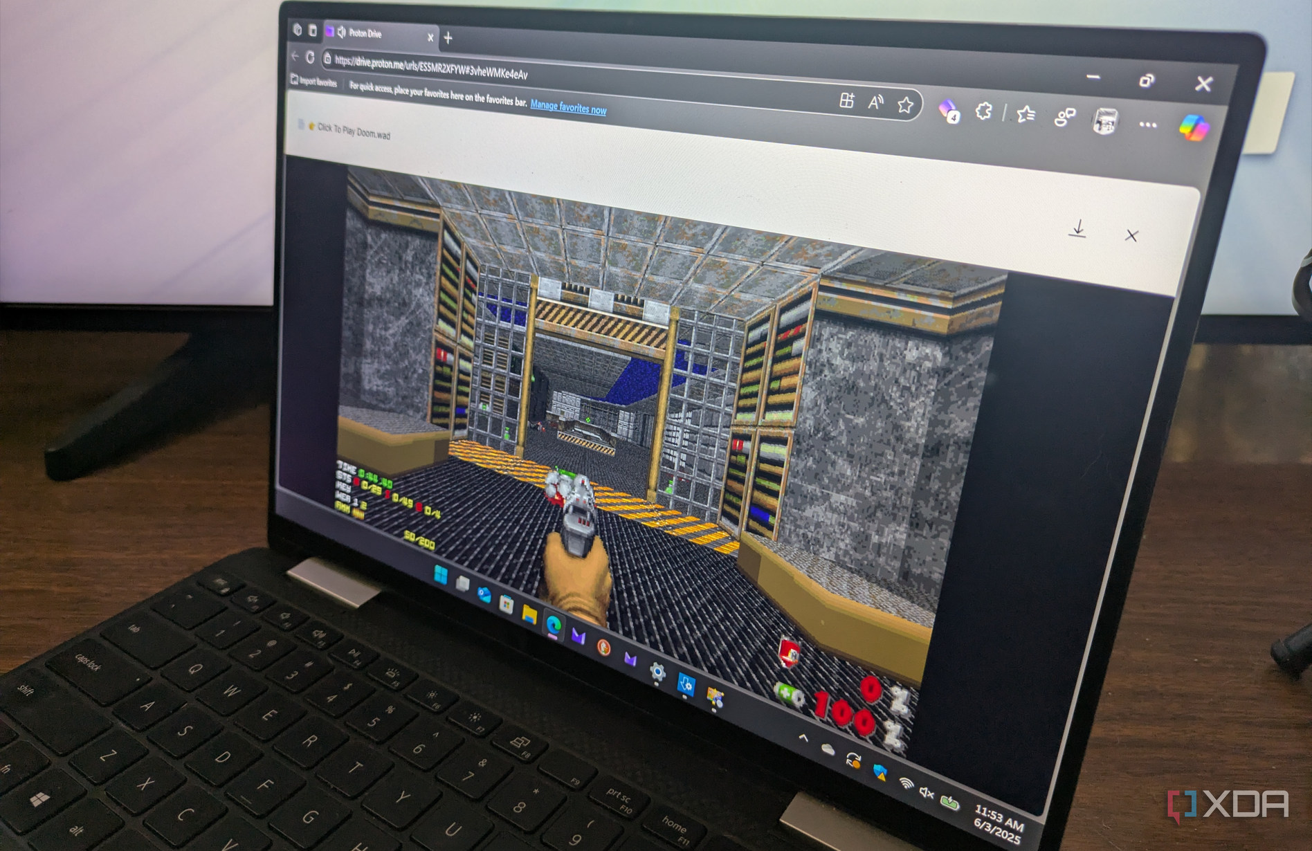Shows playing Doom via Proton Drive on laptop