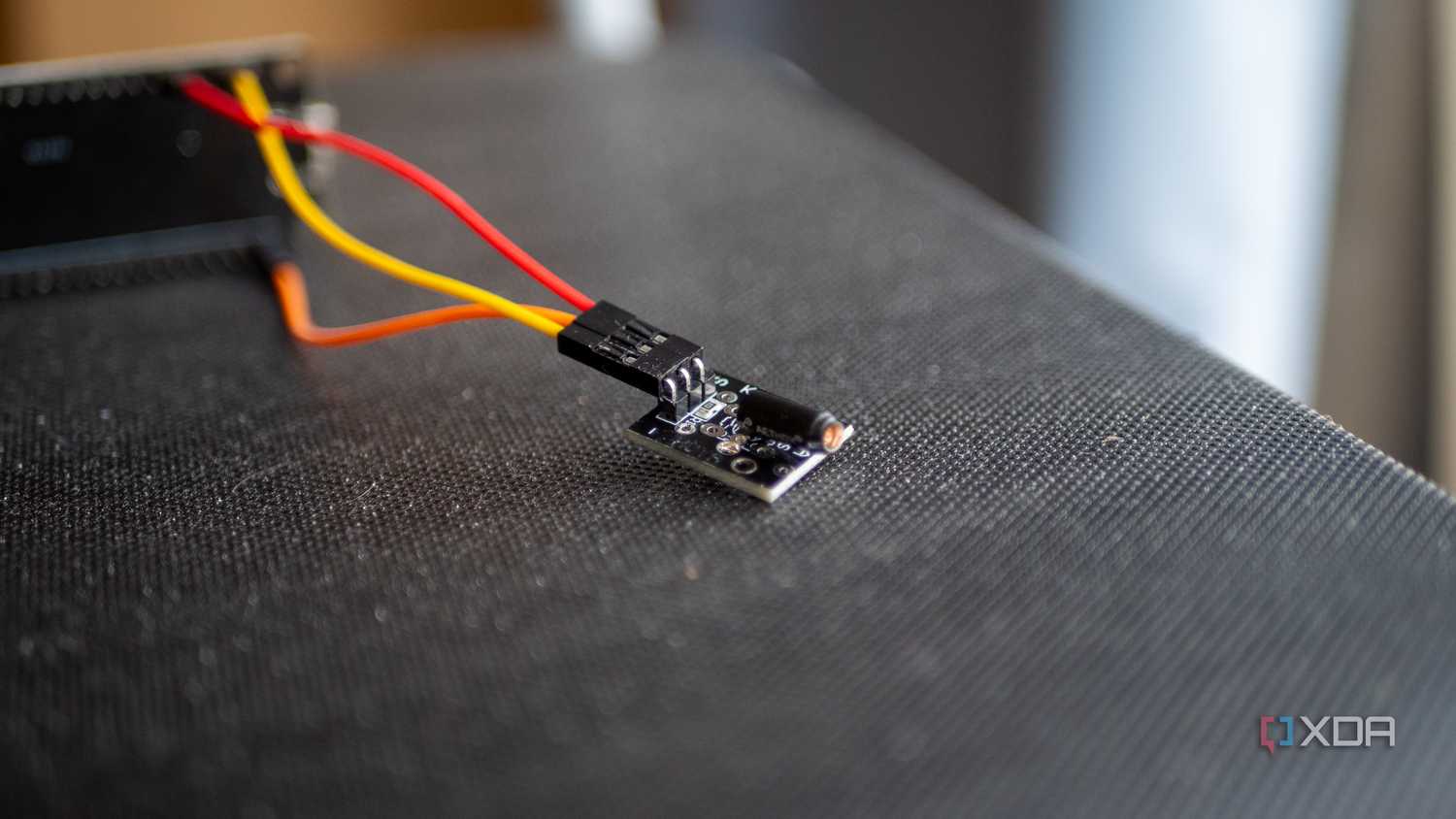 ky-002 vibration sensor plugged into an ESP32 board