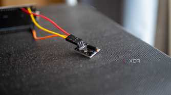 ky-002 vibration sensor plugged into an ESP32 board