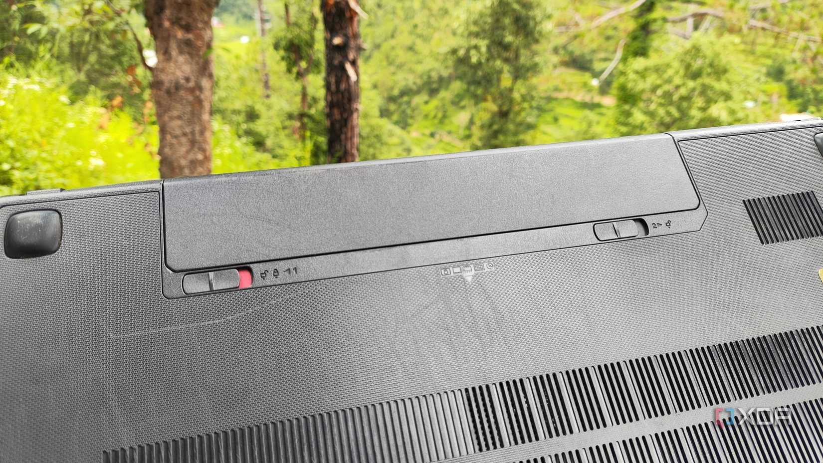 The battery slot on an old laptop