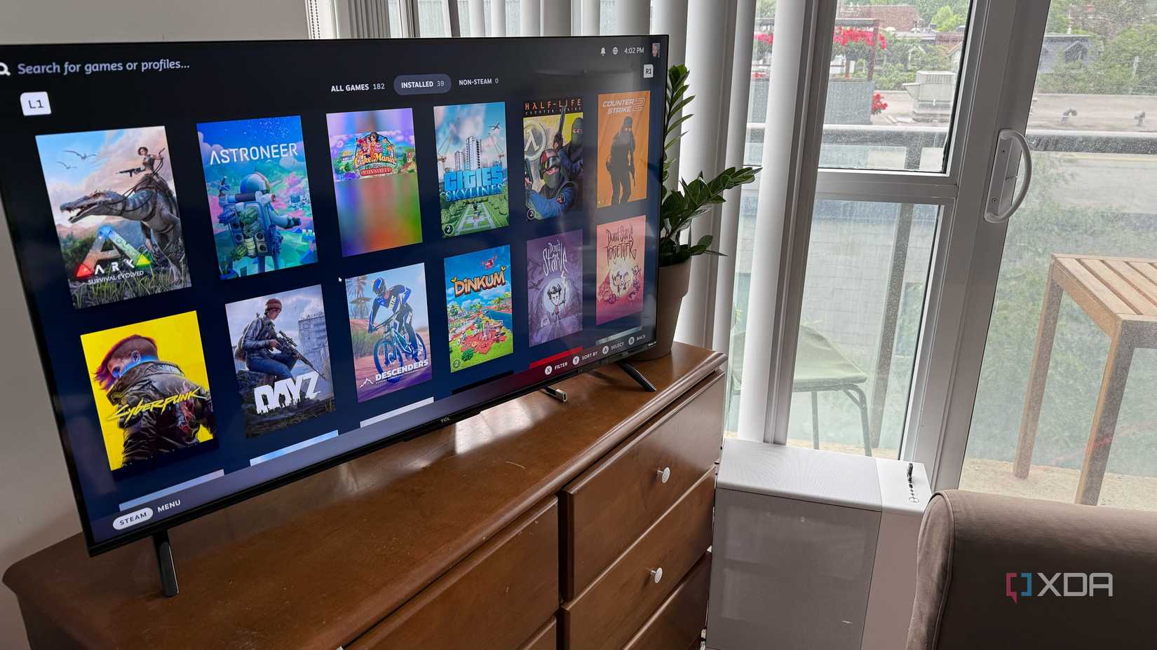 A photo of a PC connected to a TV, showing Steam