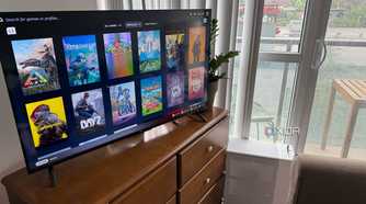 A photo of a PC connected to a TV, showing Steam