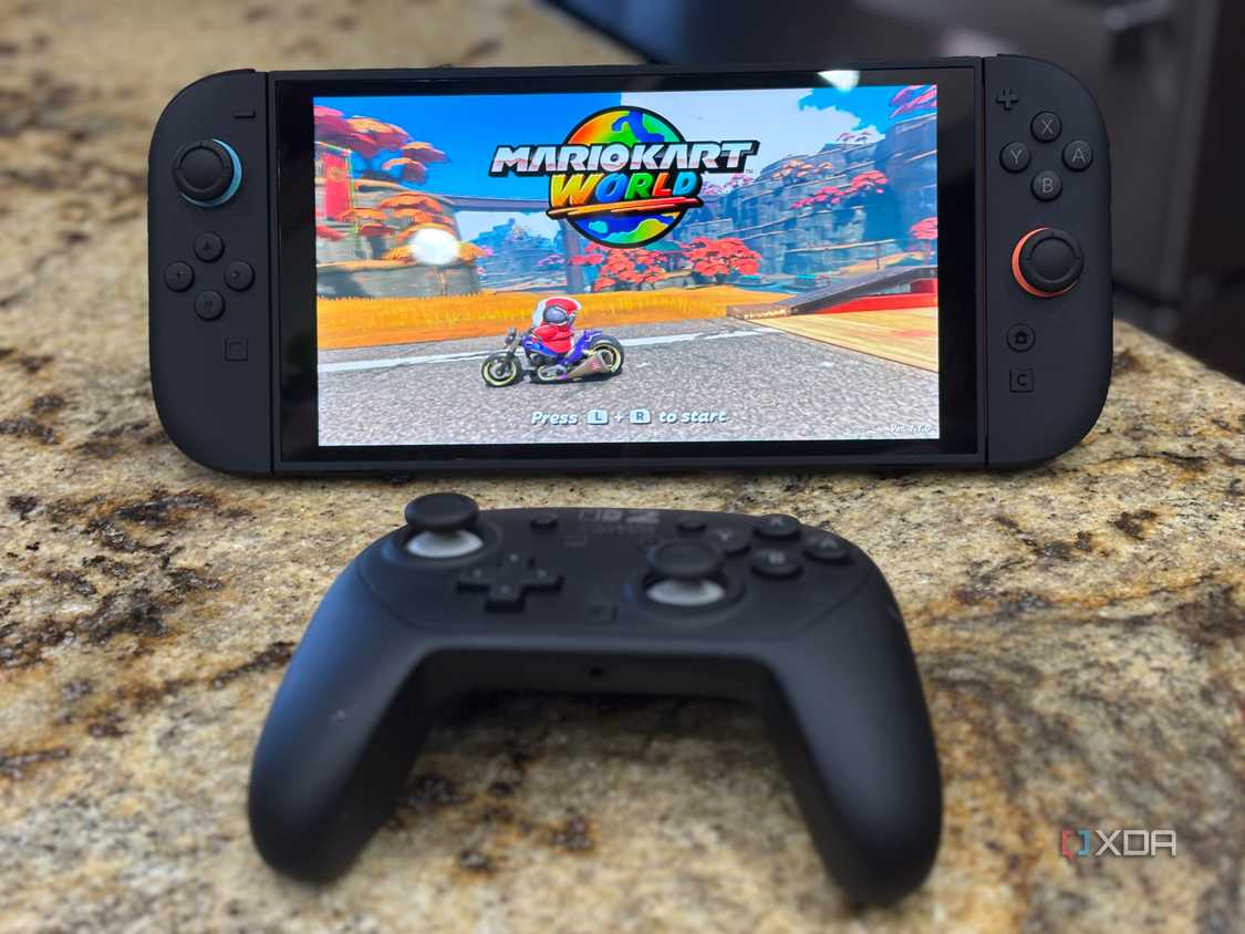 A switch 2 with a pro controller in front of it while playing mario kart