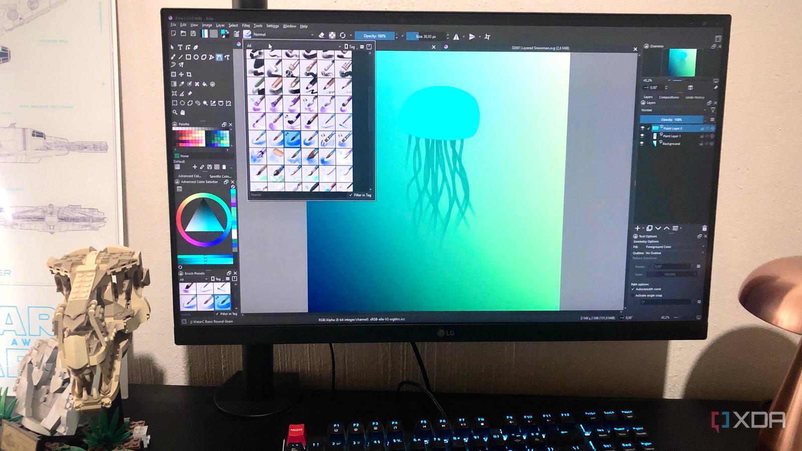 Krita jellyfish design displayed on desktop pc, with lego and lamp in view