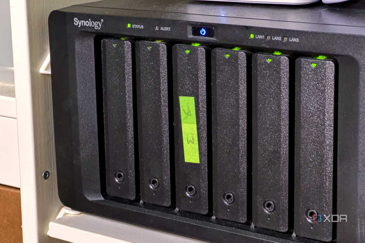 nas with green sticky label on the third drive sled