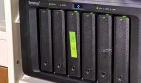nas with green sticky label on the third drive sled