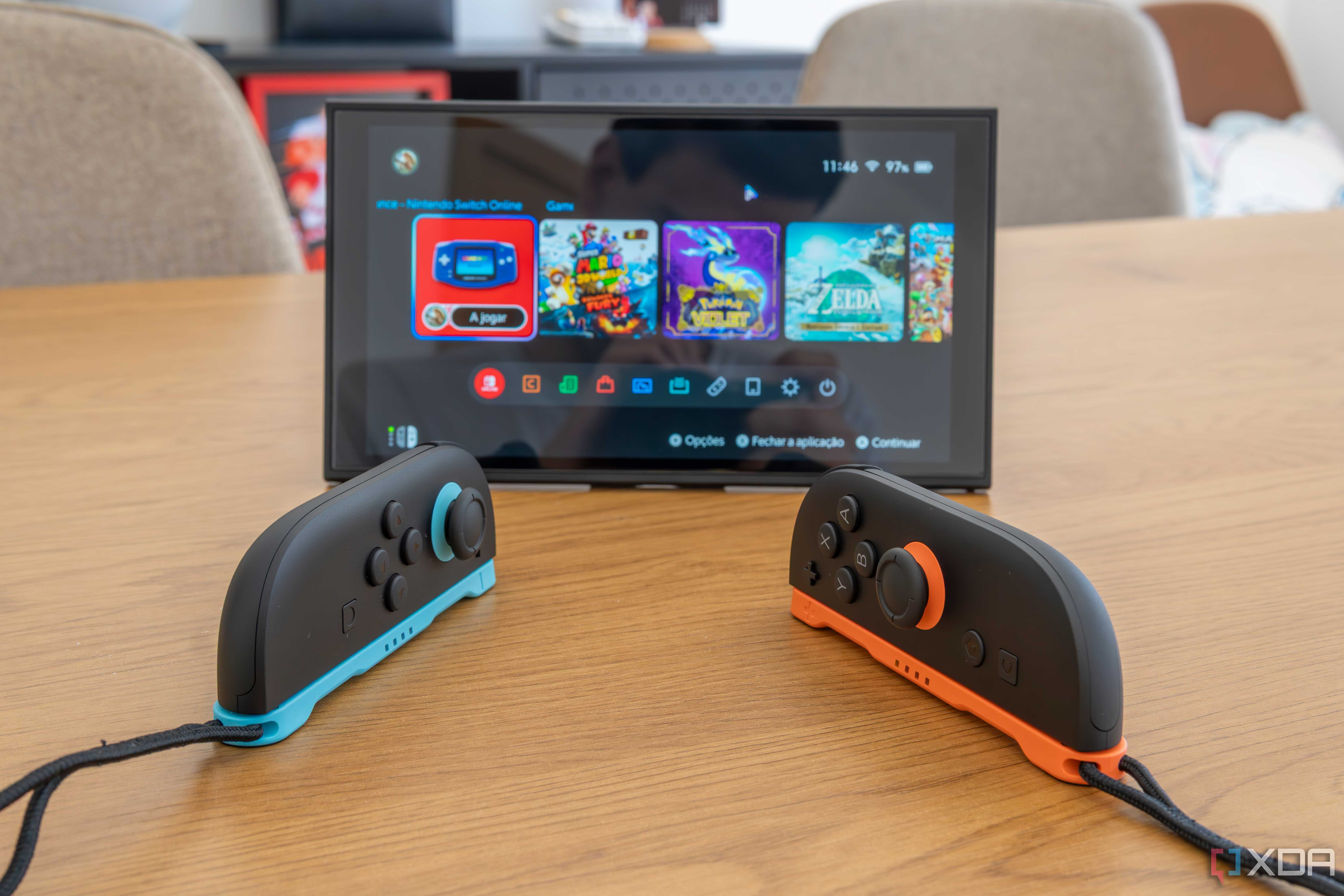 Two Joy-Con 2 controllers in mouse mode in front of a Nintendo Switch 2 in tabletop mode