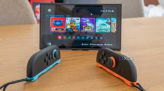 Two Joy-Con 2 controllers in mouse mode in front of a Nintendo Switch 2 in tabletop mode
