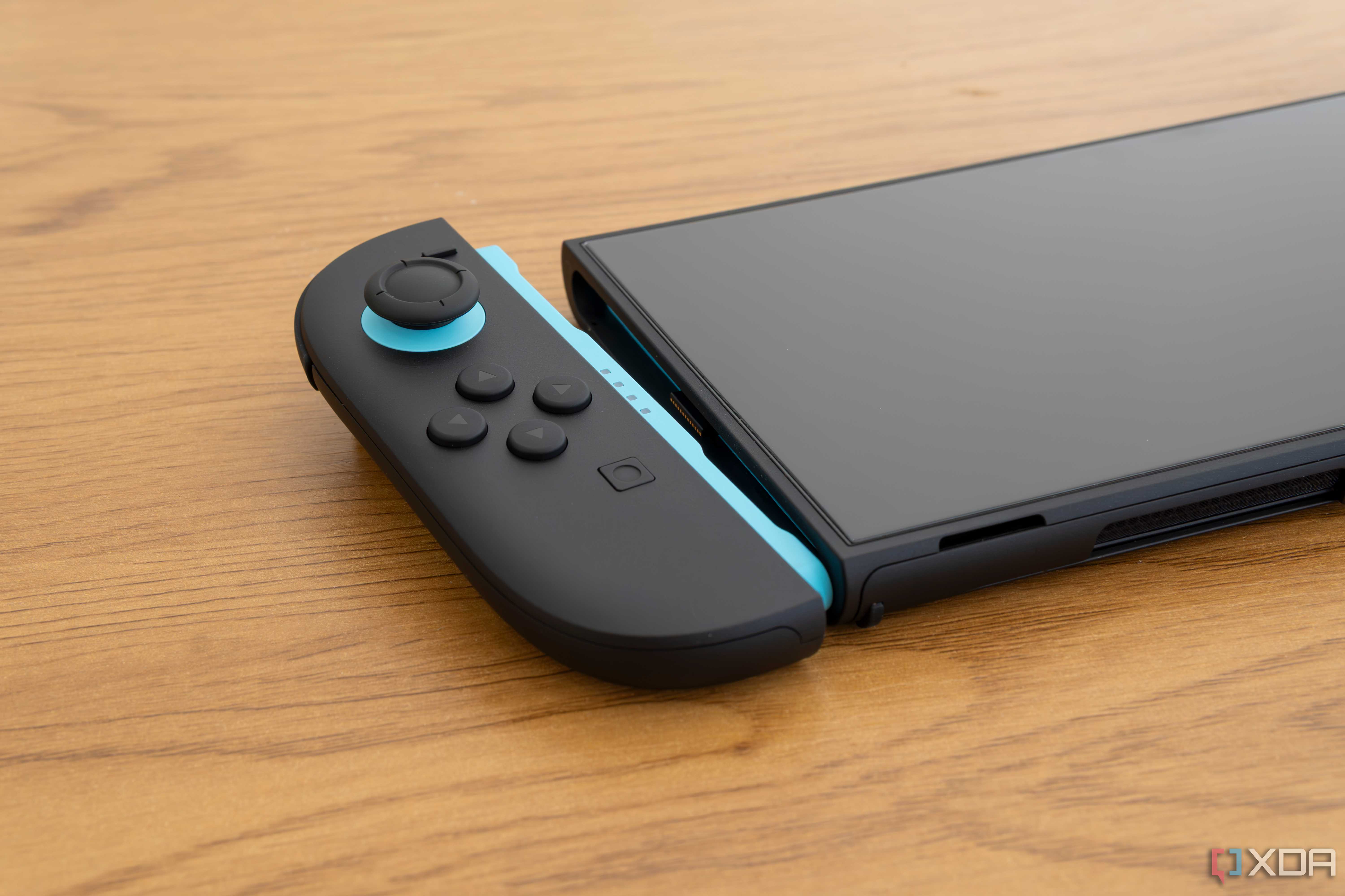 Close-up of a detached Joy-Con 2 controller next to the respective slot on the console
