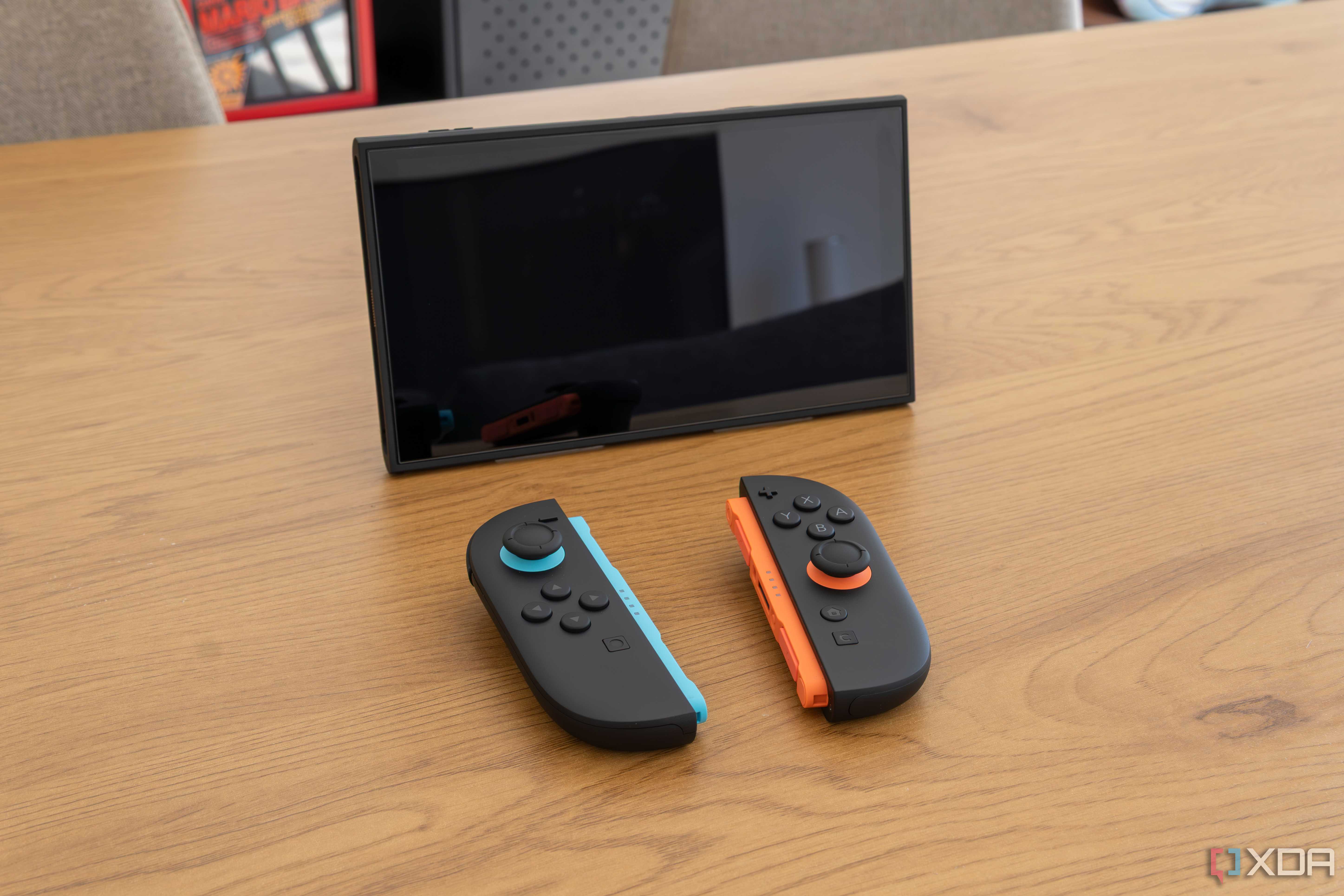 A Nintendo Switch 2 in tabletop mode with detached Joy-Con 2 controllers in front of it