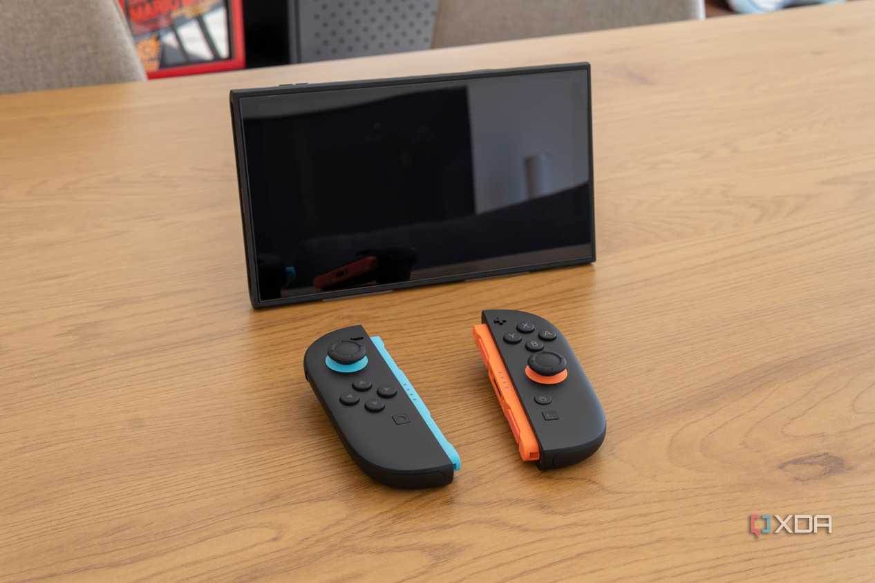 A Nintendo Switch 2 in tabletop mode with detached Joy-Con 2 controllers in front of it