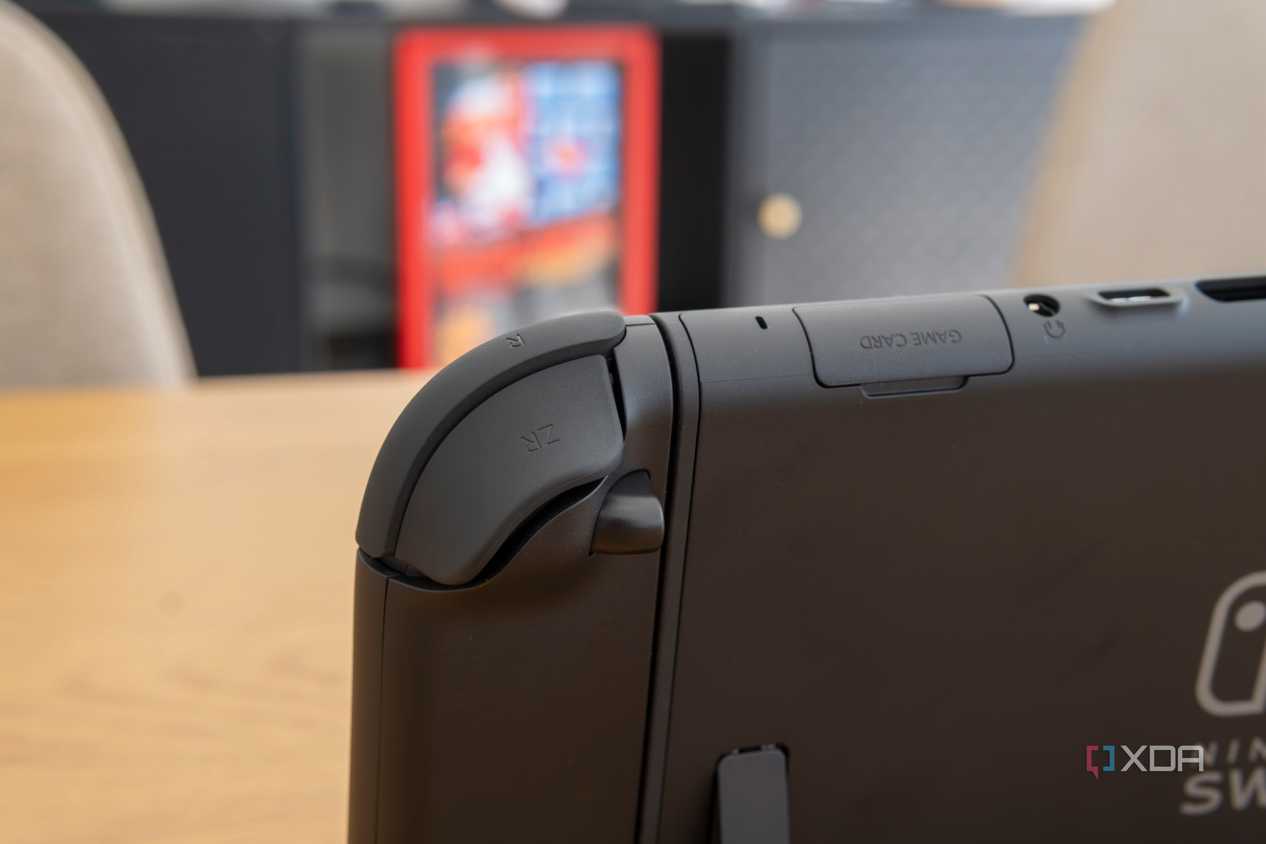 Close-up view of the right Joy-Con seen from behind, showing the shoulder buttons and the release button