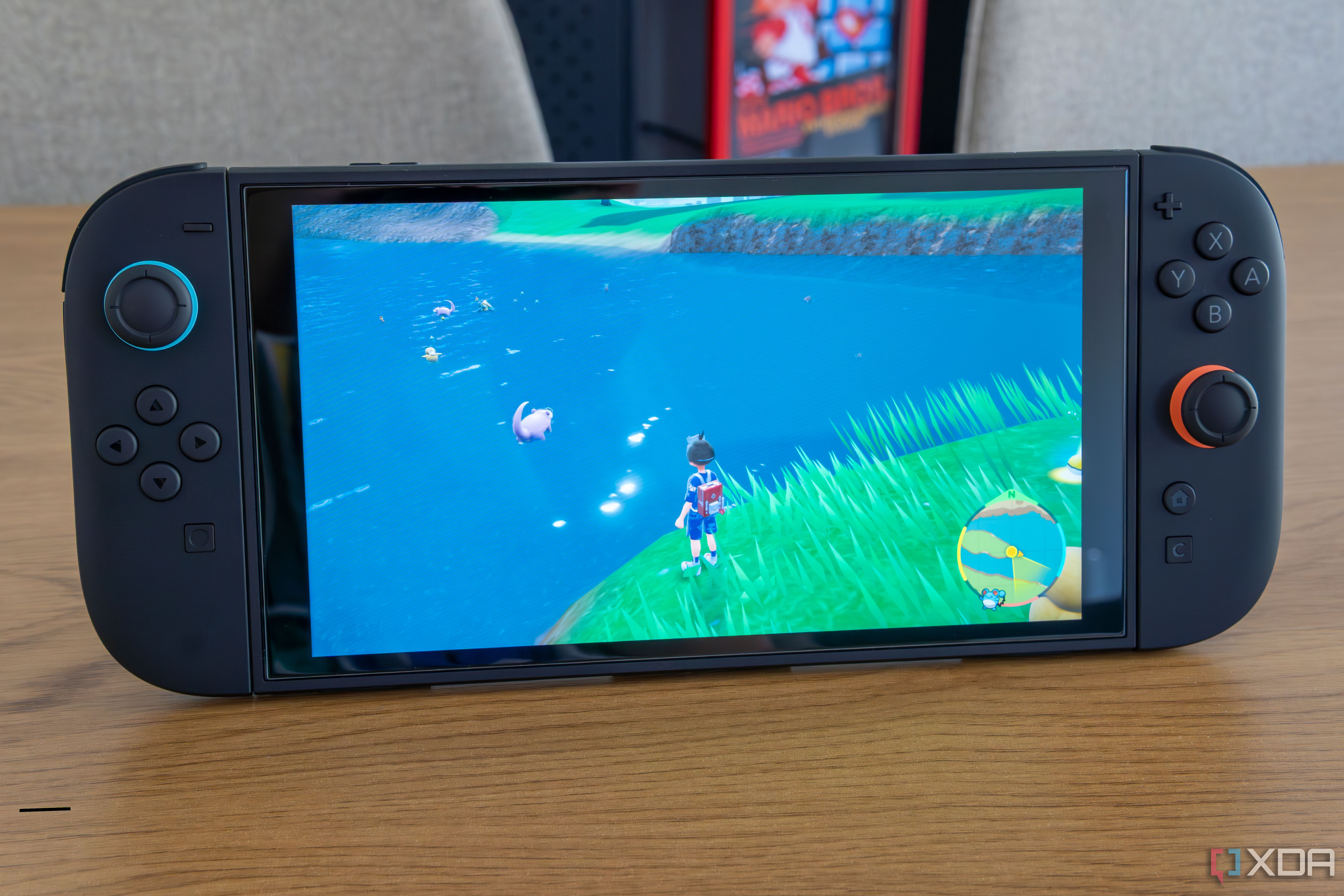 A Nintendo Switch 2 running Pokémon Scarlet and Violet with the Joy-Con attached