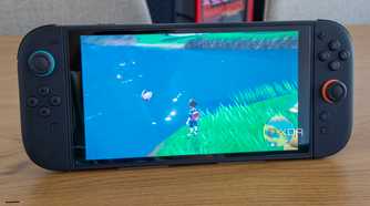 A Nintendo Switch 2 running Pokémon Scarlet and Violet with the Joy-Con attached