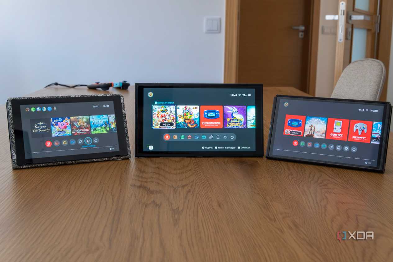 An original Nintendo Switch, a Nintendo Switch OLED model, and a Nintendo Switch 2, all displaying the home menu