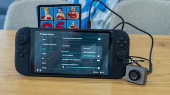 A Nintendo Switch 2 with an Obsbot Meet 2 connected. The camera's microphone is detected in the console's settings