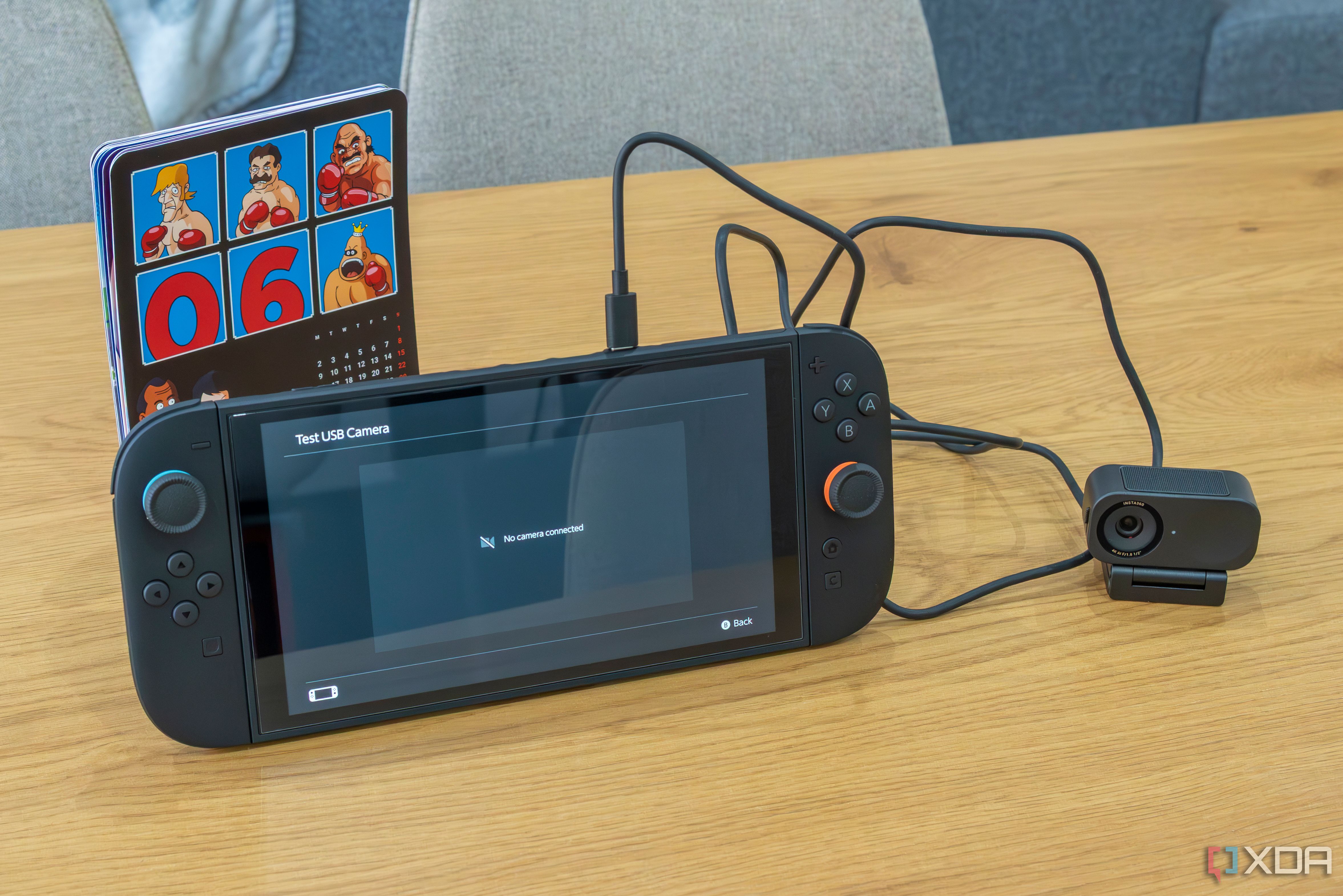A Nintendo Switch 2 with an Insta360 Link 2C connected. The console indicates no camera is connected