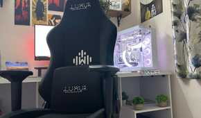 An image of a gaming chair next to a gaming PC.