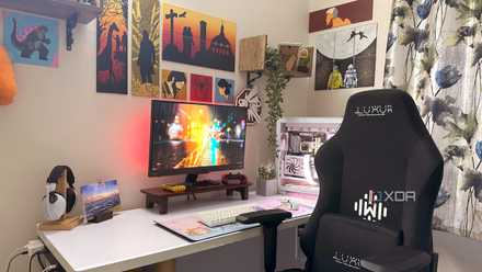 An image of a white computer table with a gaming PC.