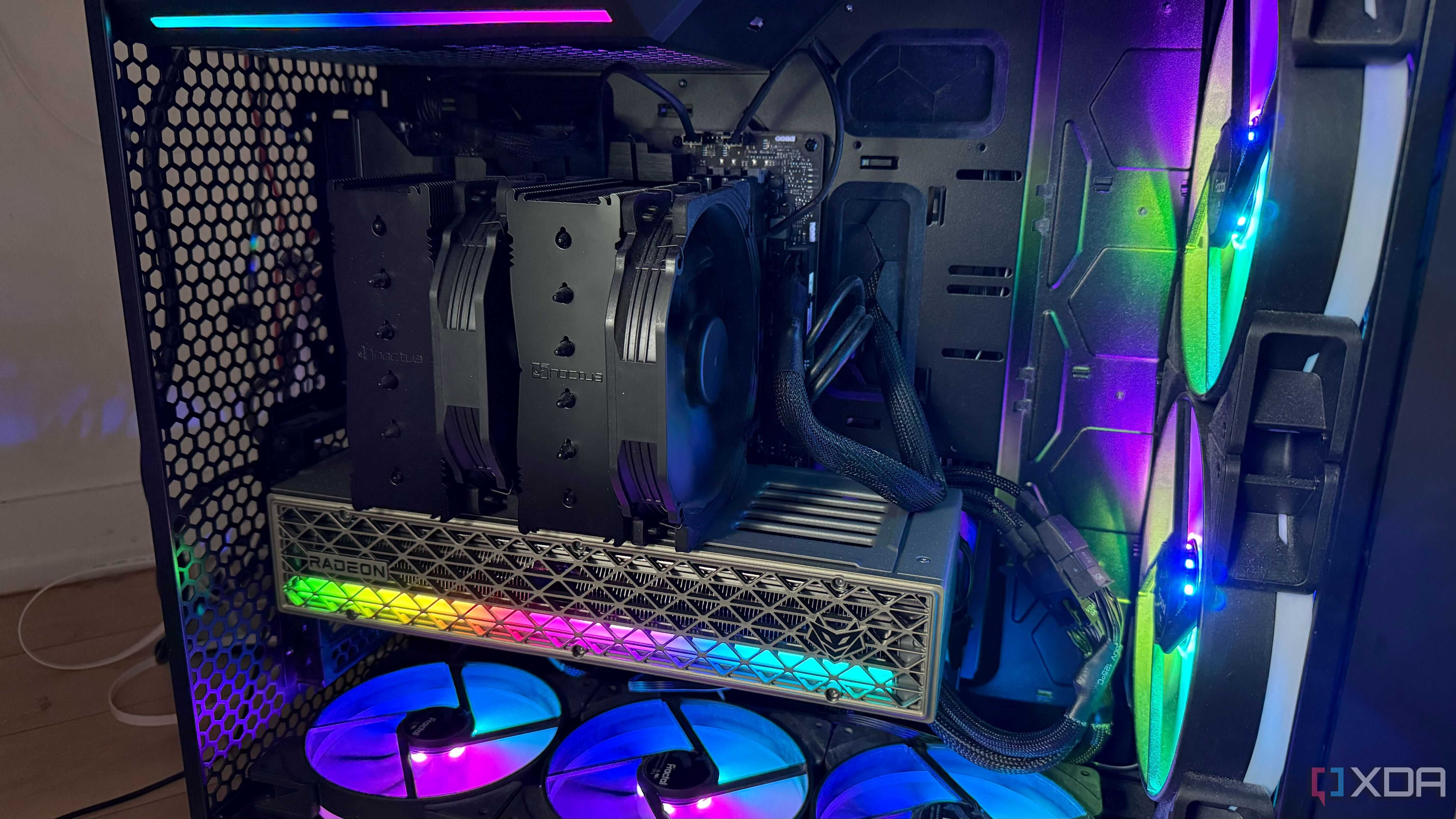 A photo of a PC build powered on with RGB lights and an air cooler