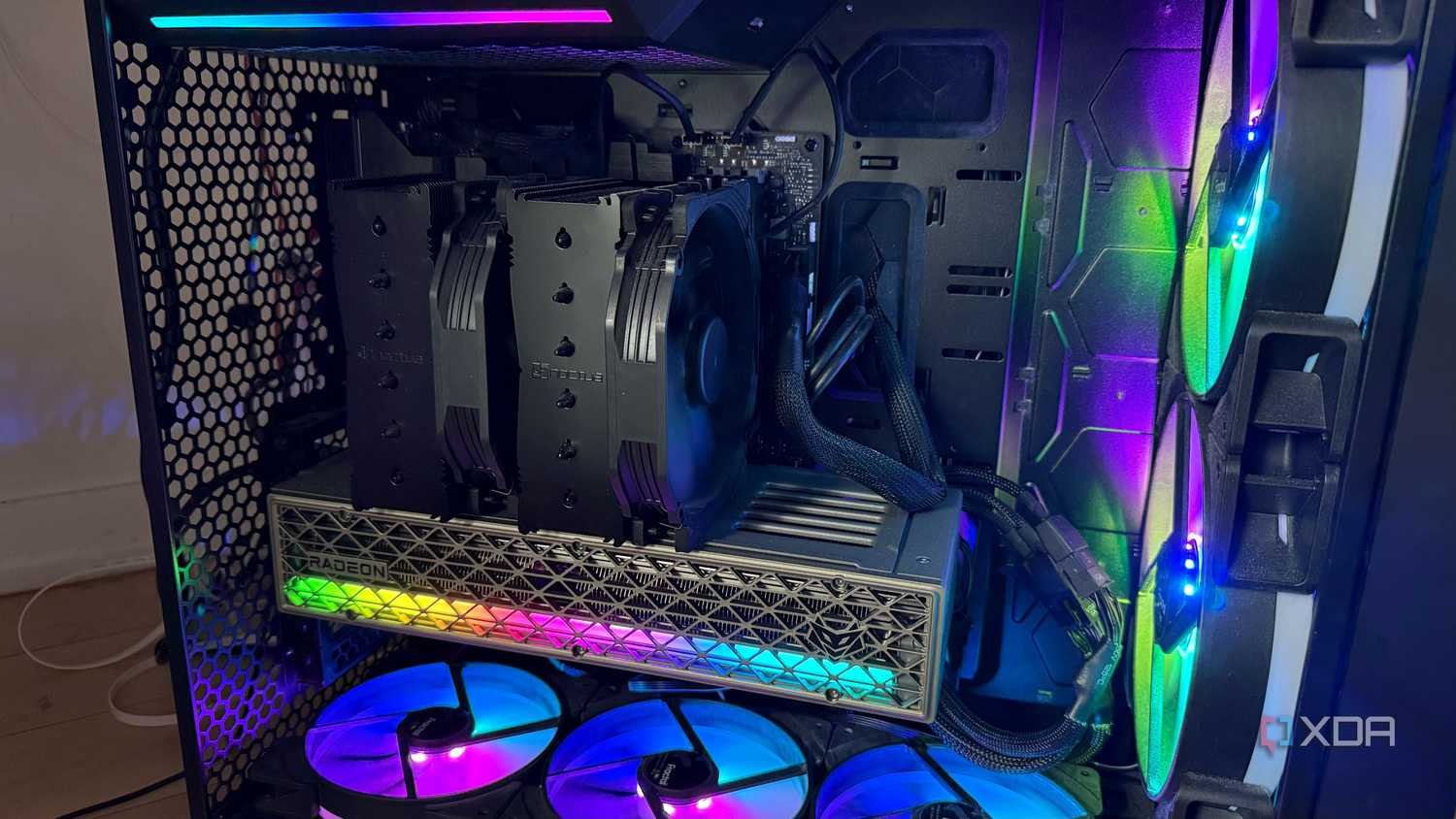 A photo of a PC build powered on with RGB lights and an air cooler