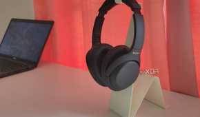Black Sony headphones on a white stand