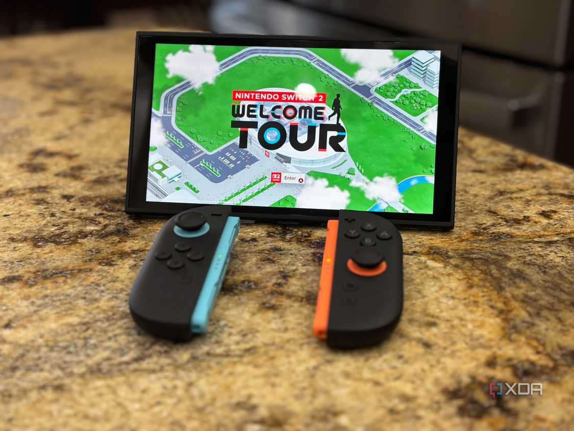 A switch 2 console with joy-cons in front of it playing Welcome Tour