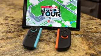 A switch 2 console with joy-cons in front of it playing Welcome Tour