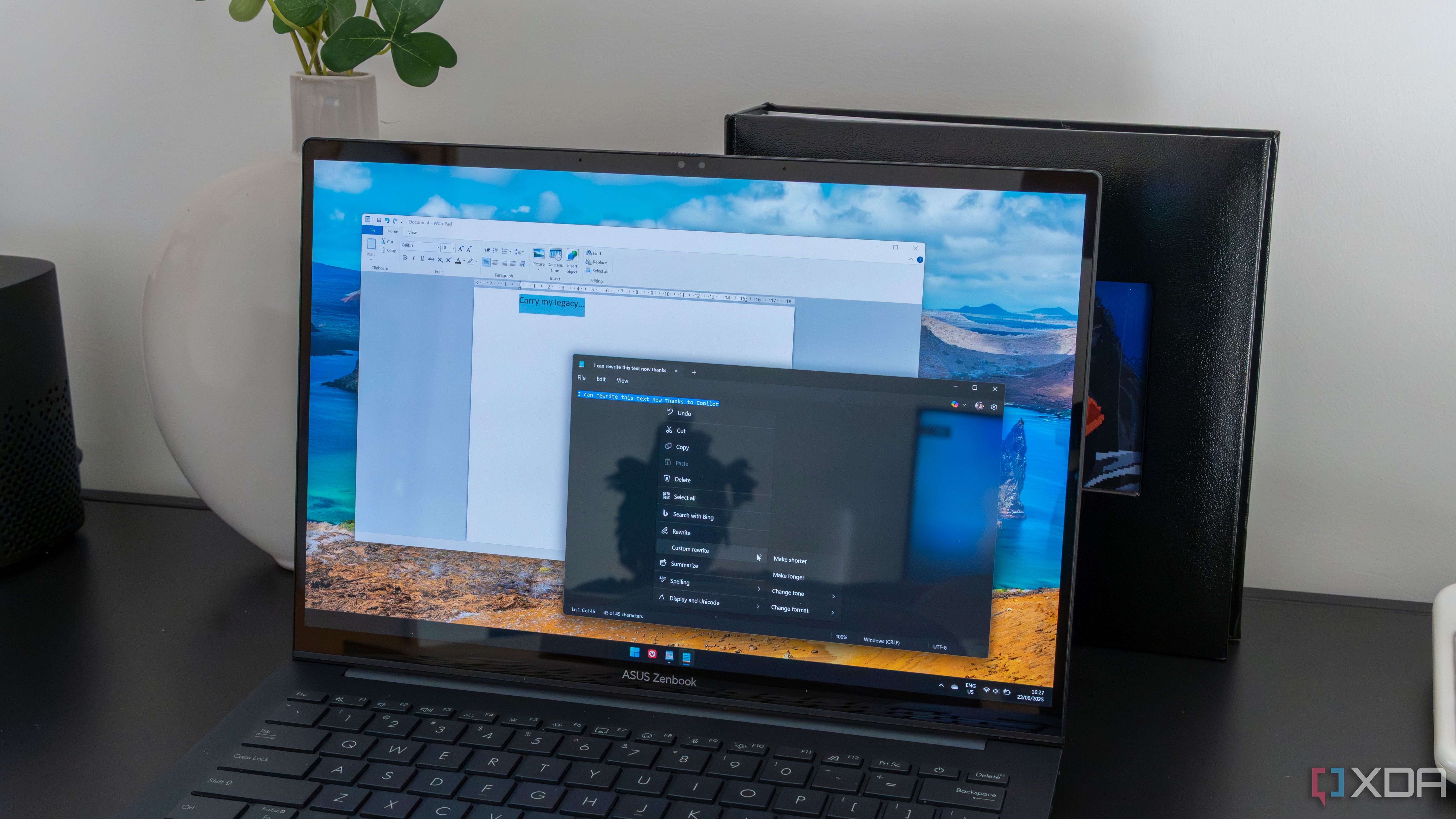 A Windows 11 laptop running WordPad and Notepad