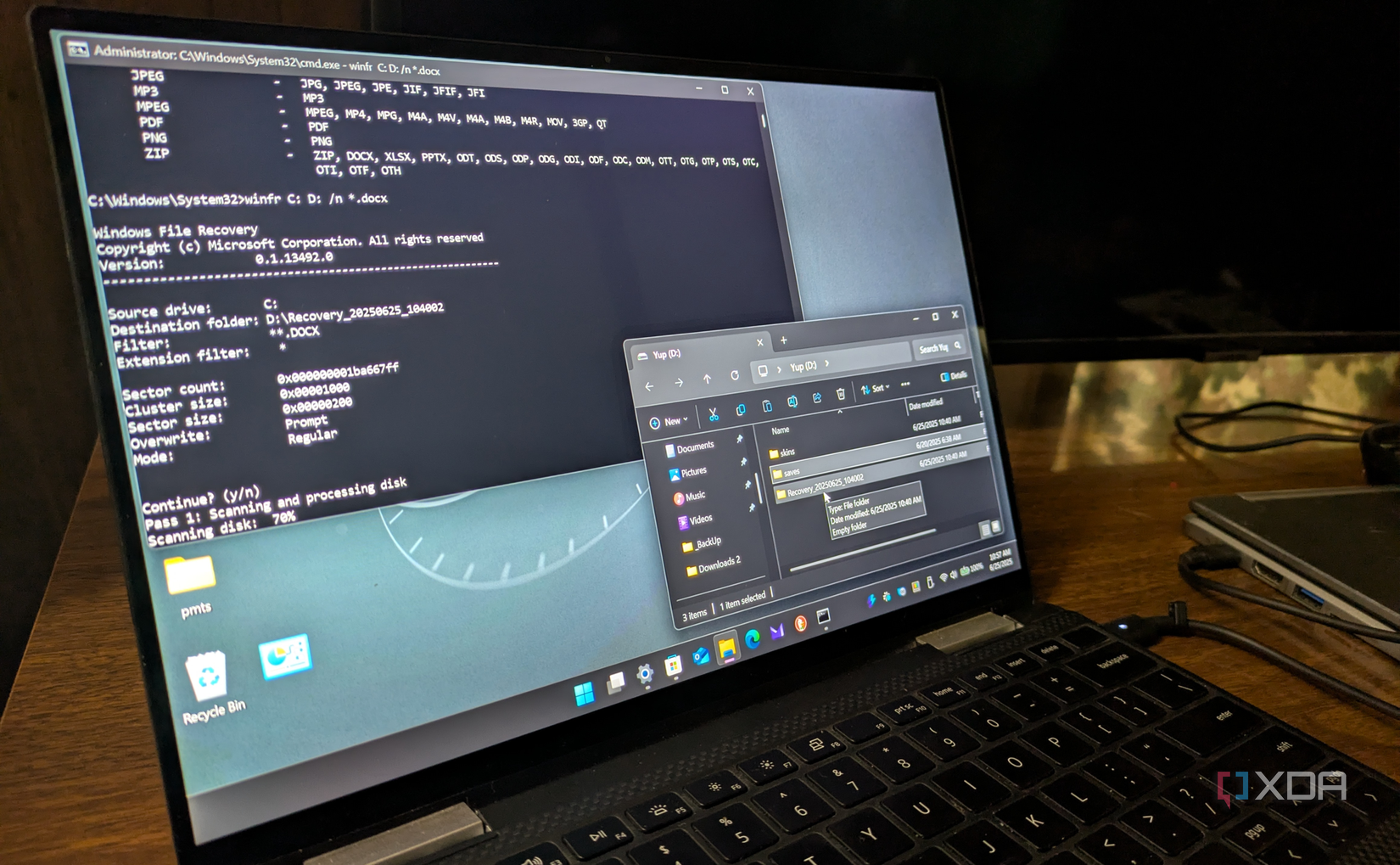 Shows Windows File Recovery tool running on laptop