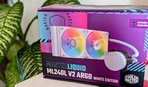 An AIO liquid cooler box on a desk next to a plant