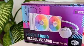 An AIO liquid cooler box on a desk next to a plant