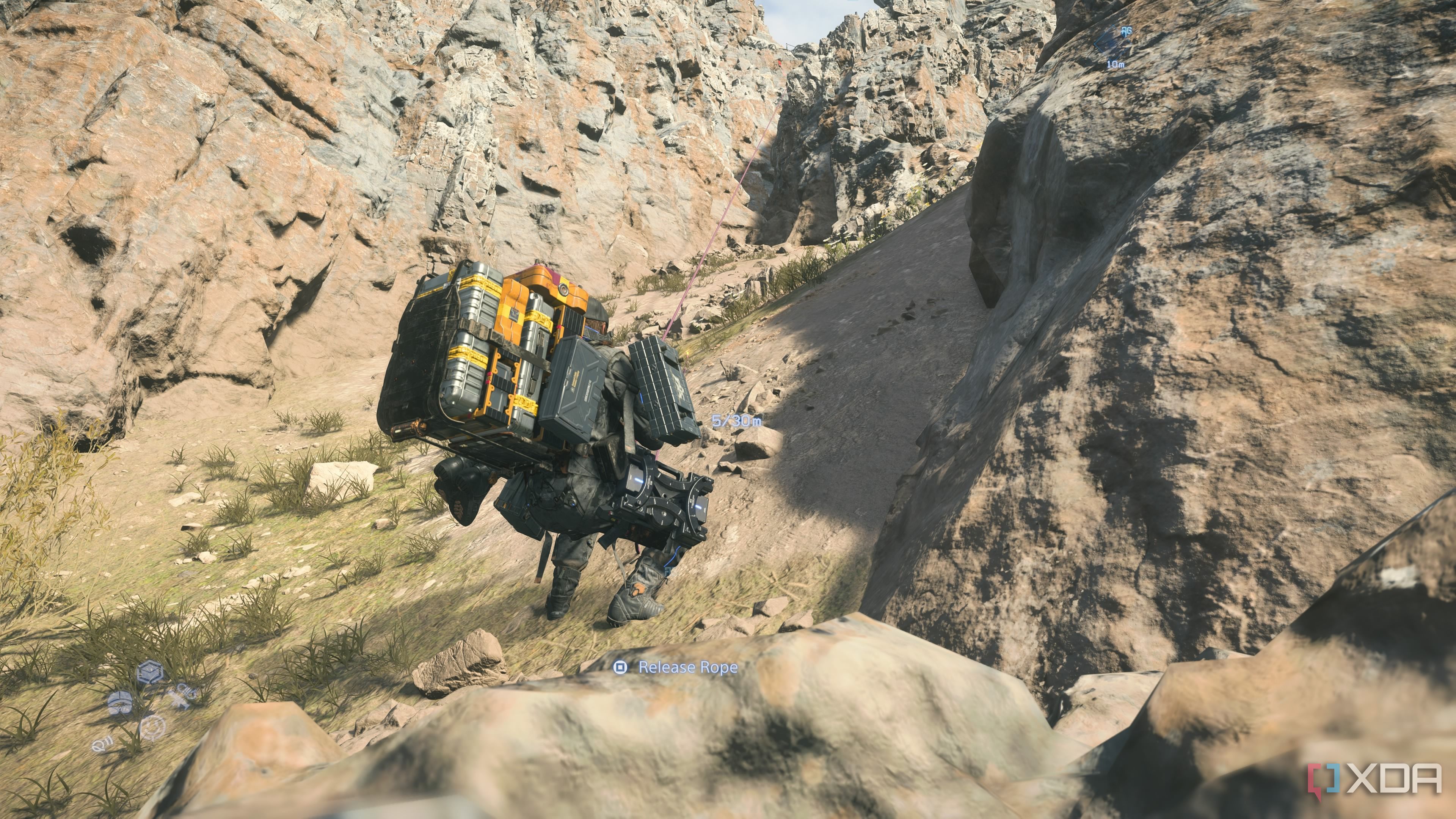 Sam rappelling down a cliff in Death Stranding 2.