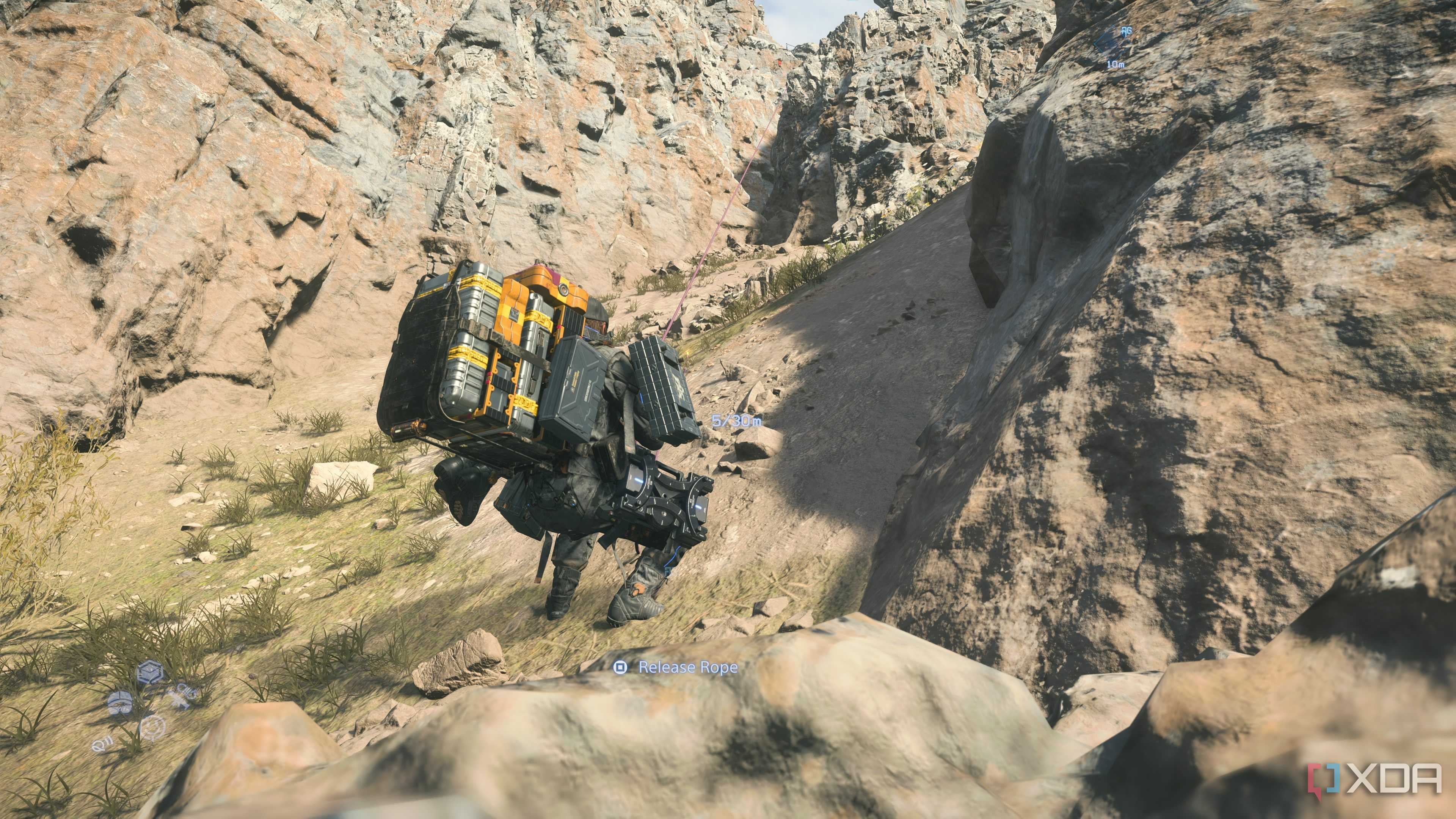 Sam rappelling down a cliff in Death Stranding 2.
