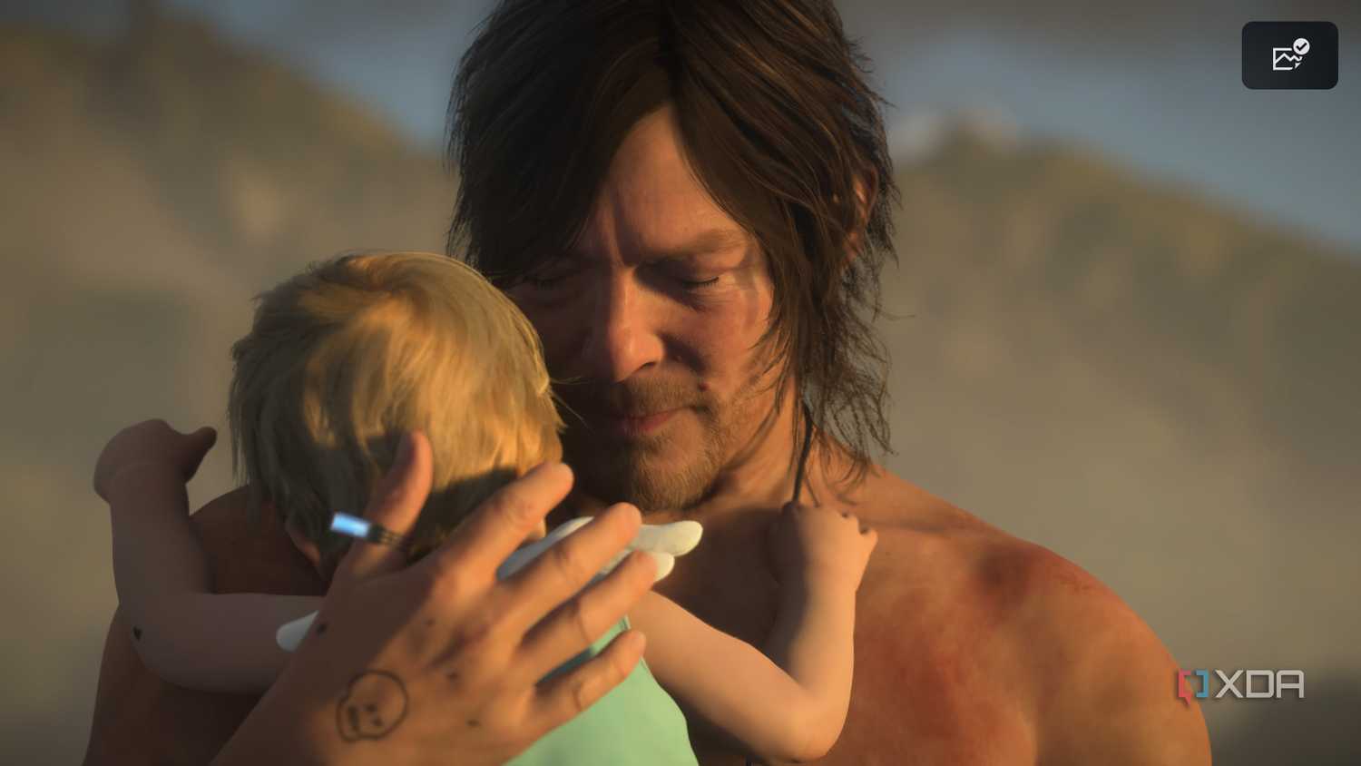 Sam holding Lou on the beach in Death Stranding 2.