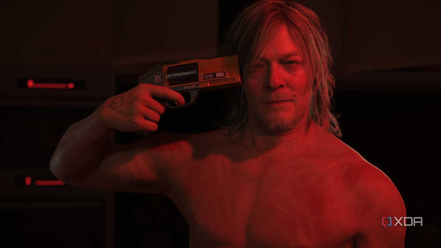 Sam Porter Bridges holding a gun to his own head.