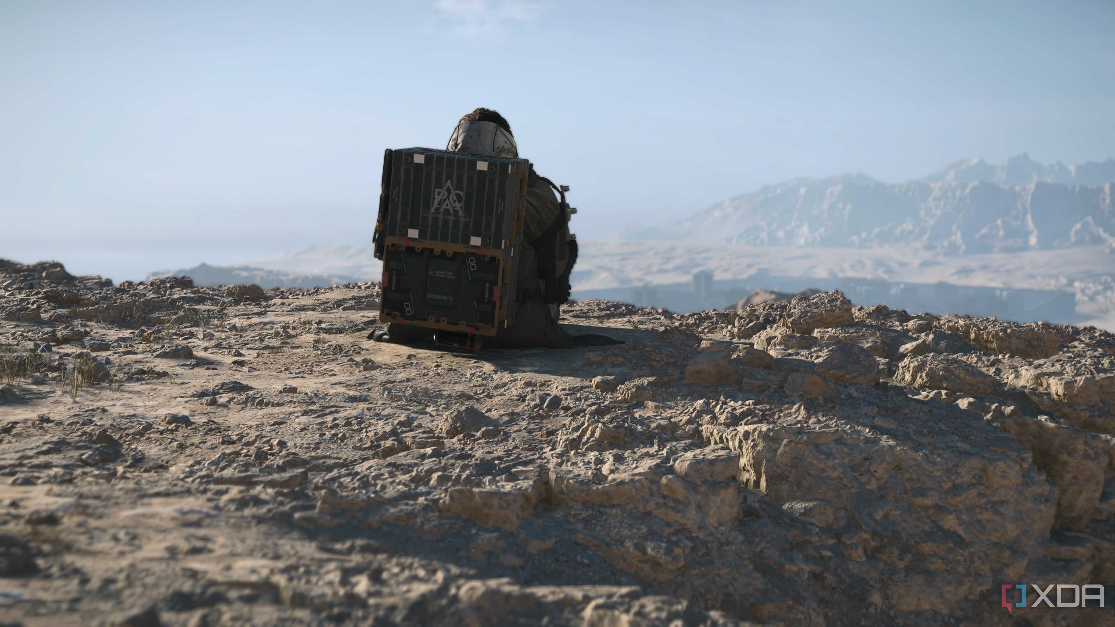 Sam seated at a cliff in Death Stranding 2.